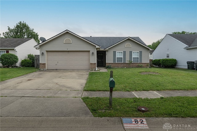 82 Choctaw Cir, Franklin, OH 45005 - ranch-style house featuring brick siding, a garage, a front lawn, and concrete driveway