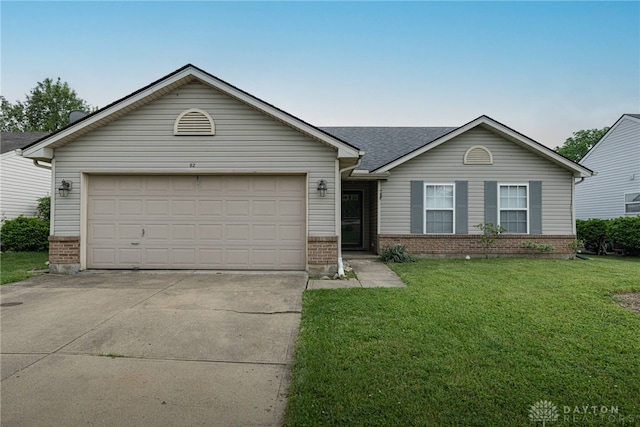 82 Choctaw Cir, Franklin, OH 45005 - ranch-style house featuring brick siding, concrete driveway, a front lawn, and a garage
