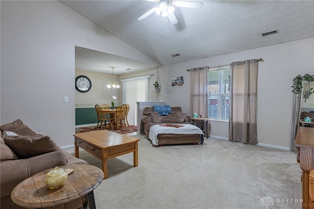 82 Choctaw Cir, Franklin, OH 45005 - carpeted living room featuring ceiling fan, a chandelier, baseboards, vaulted ceiling, and a textured ceiling