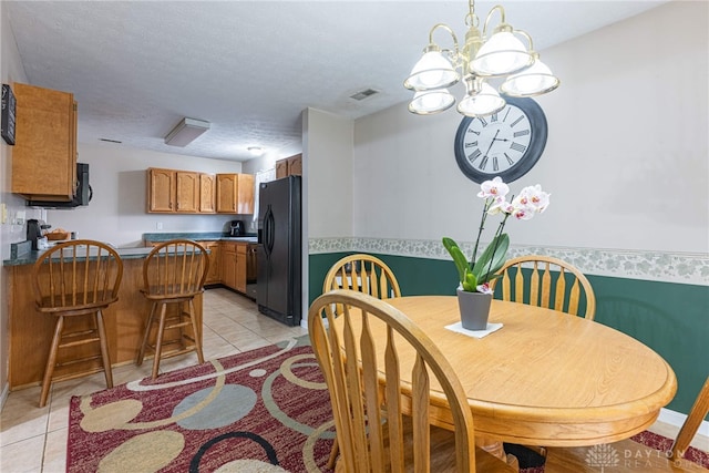 82 Choctaw Cir, Franklin, OH 45005 - dining area with light tile patterned flooring and a chandelier