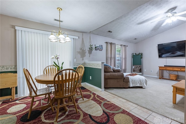 82 Choctaw Cir, Franklin, OH 45005 - carpeted dining area featuring a chandelier, tile patterned flooring, vaulted ceiling, a ceiling fan, and a textured ceiling