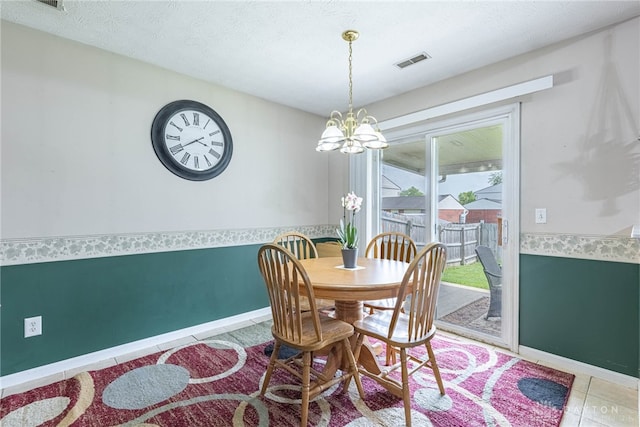 82 Choctaw Cir, Franklin, OH 45005 - dining space featuring a chandelier, baseboards, and tile patterned flooring