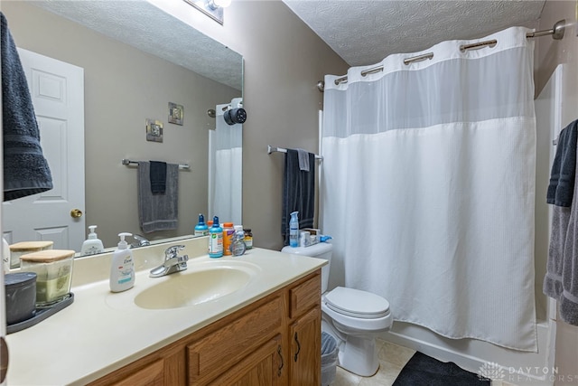82 Choctaw Cir, Franklin, OH 45005 - bathroom with a textured ceiling, vanity, toilet, tile patterned flooring, and shower / tub combo with curtain