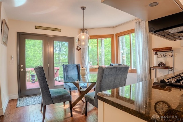 849 Wind Blf, Springboro, OH 45066 - dining area with plenty of natural light, light wood-style floors, and baseboards