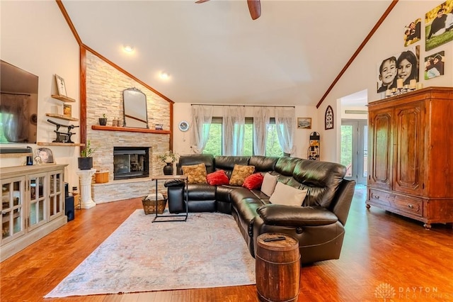 849 Wind Blf, Springboro, OH 45066 - living room featuring healthy amount of natural light, high vaulted ceiling, ceiling fan, a fireplace, and wood finished floors