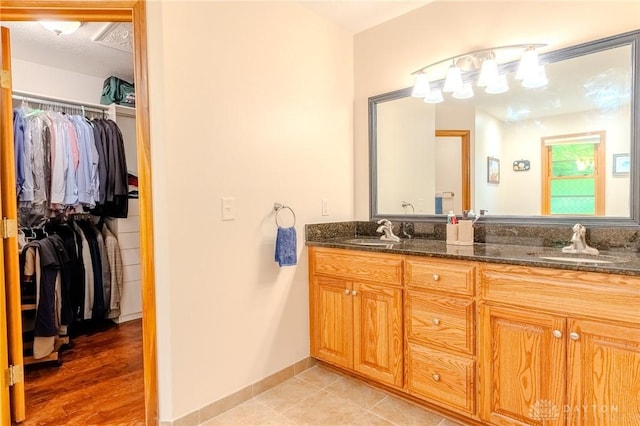 849 Wind Blf, Springboro, OH 45066 - bathroom featuring a walk in closet and double vanity