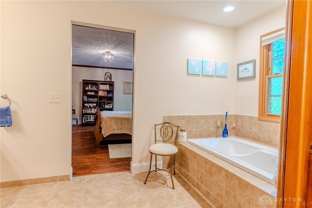 849 Wind Blf, Springboro, OH 45066 - bathroom featuring a garden tub, ensuite bathroom, baseboards, and recessed lighting