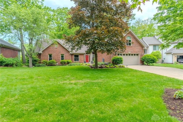 849 Wind Blf, Springboro, OH 45066 - view of front facade with brick siding, driveway, a garage, and a front yard