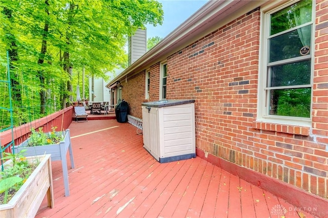 849 Wind Blf, Springboro, OH 45066 - wooden deck featuring a vegetable garden and outdoor dining area