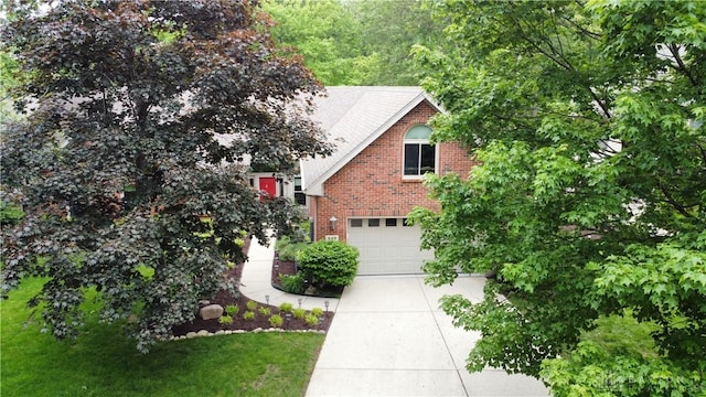 849 Wind Blf, Springboro, OH 45066 - view of front of home featuring concrete driveway, brick siding, and an attached garage