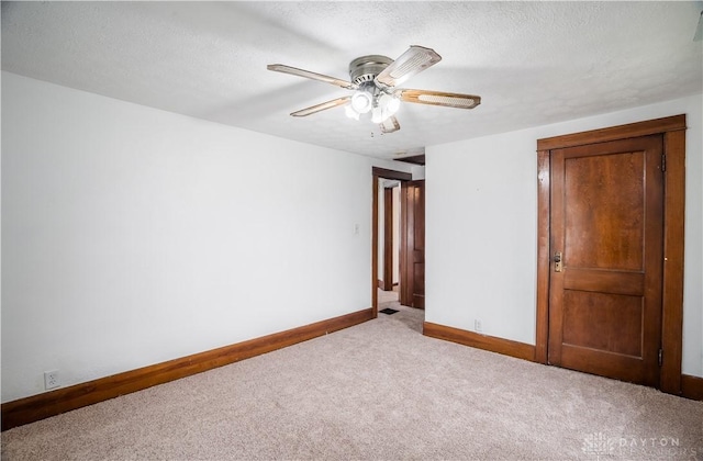 20 N 10th St, Miamisburg, OH 45342 - unfurnished bedroom with carpet, baseboards, ceiling fan, and a textured ceiling