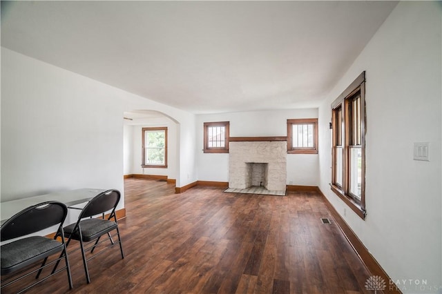 20 N 10th St, Miamisburg, OH 45342 - living area with wood-type flooring, a fireplace, and arched walkways