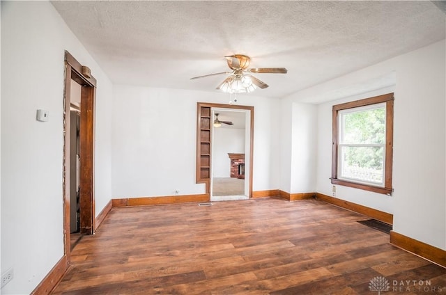 20 N 10th St, Miamisburg, OH 45342 - empty room featuring a ceiling fan, wood finished floors, and a textured ceiling