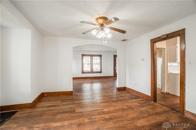 20 N 10th St, Miamisburg, OH 45342 - empty room with arched walkways, wood finished floors, baseboards, and a ceiling fan