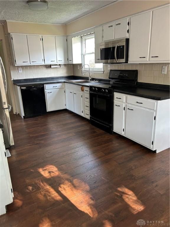 20 N 10th St, Miamisburg, OH 45342 - kitchen featuring black appliances, dark countertops, dark wood-style floors, decorative backsplash, and a textured ceiling