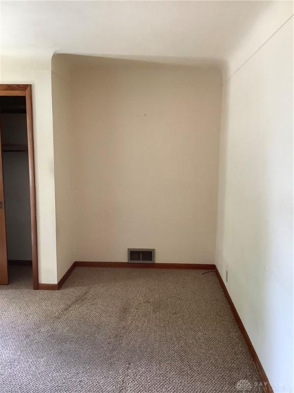 109 Anderson St, New Madison, OH 45346 - unfurnished bedroom featuring carpet flooring and baseboards