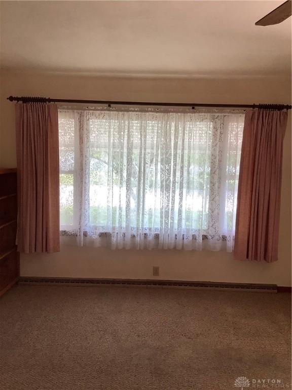 109 Anderson St, New Madison, OH 45346 - spare room with plenty of natural light, a ceiling fan, and carpet