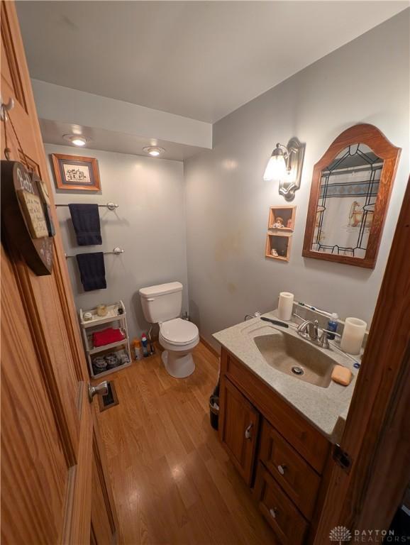 7430 S Kessler Fred Rd, West Milton, OH 45383 - half bath with vanity and wood finished floors