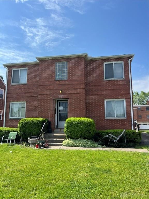 120 E Dorothy Ln, Kettering, OH 45419 - view of front of home with a front yard and brick siding