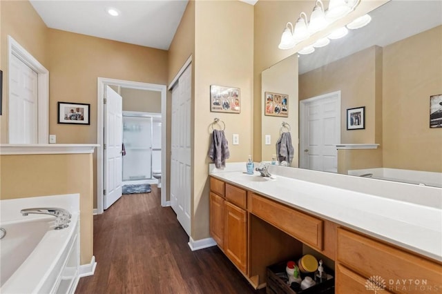 2684 Cedarbrook Way, Beavercreek, OH 45431 - bathroom featuring a bath, vanity, wood finished floors, an enclosed shower, and recessed lighting