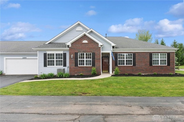 2684 Cedarbrook Way, Beavercreek, OH 45431 - view of front of property featuring an attached garage, brick siding, a front yard, asphalt driveway, and roof with shingles