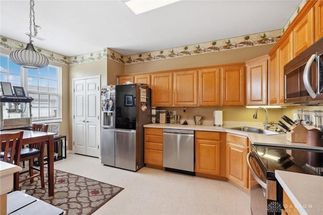 2684 Cedarbrook Way, Beavercreek, OH 45431 - kitchen featuring appliances with stainless steel finishes, light countertops, and decorative light fixtures