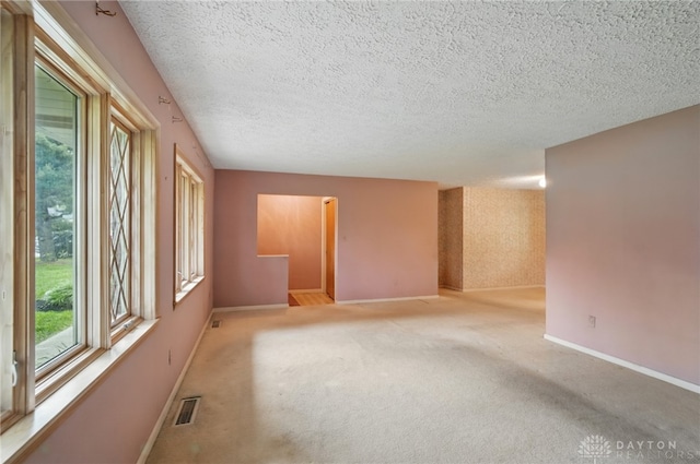 141 W Rahn Rd, Washington Twp, OH 45429 - spare room with baseboards, light carpet, and a textured ceiling