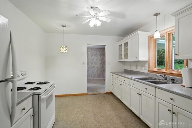 141 W Rahn Rd, Washington Twp, OH 45429 - kitchen featuring white appliances, a sink, a ceiling fan, baseboards, and white cabinetry