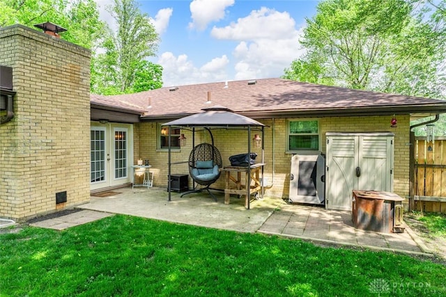 1493 N Sulphur Springs Rd, West Alexandria, OH 45381 - rear view of property featuring french doors, brick siding, a chimney, a patio area, and a shingled roof