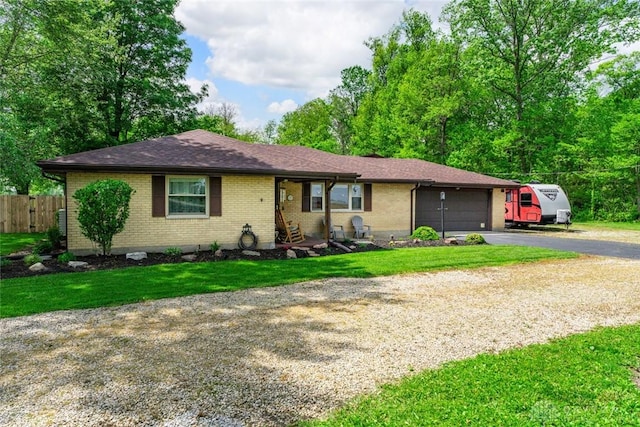 1493 N Sulphur Springs Rd, West Alexandria, OH 45381 - single story home featuring driveway, brick siding, an attached garage, and a shingled roof