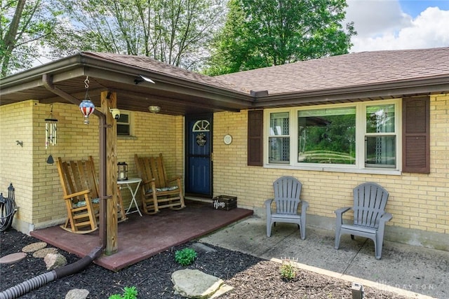 1493 N Sulphur Springs Rd, West Alexandria, OH 45381 - doorway to property featuring brick siding and a shingled roof