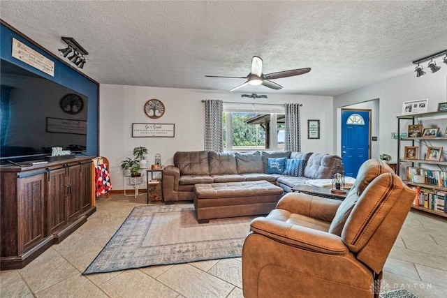 1493 N Sulphur Springs Rd, West Alexandria, OH 45381 - living area featuring rail lighting, a ceiling fan, and a textured ceiling