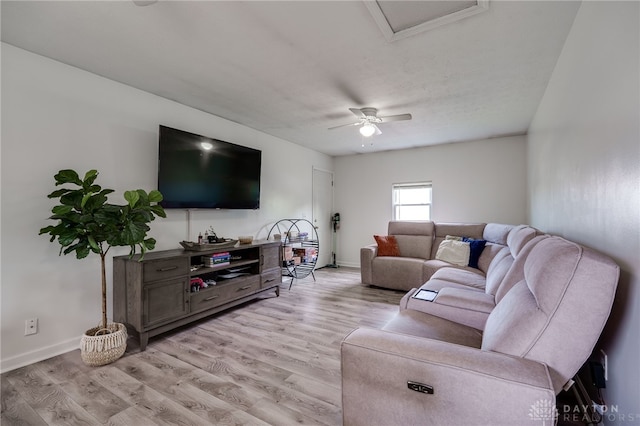1139 Chalet Dr, New Carlisle, OH 45344 - living area with light wood-style flooring, baseboards, and ceiling fan