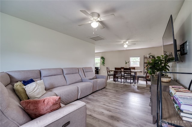 1139 Chalet Dr, New Carlisle, OH 45344 - living room featuring ceiling fan, wood finished floors, and attic access