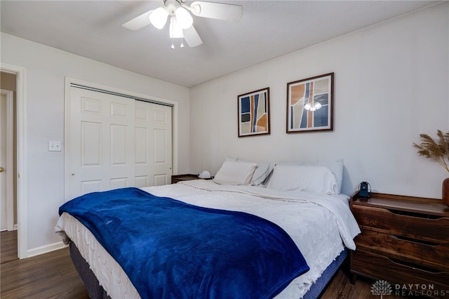 1139 Chalet Dr, New Carlisle, OH 45344 - bedroom featuring wood finished floors, a closet, baseboards, and ceiling fan