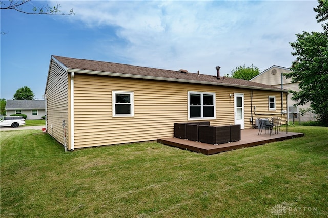 1139 Chalet Dr, New Carlisle, OH 45344 - rear view of property with outdoor lounge area, a deck, and a yard