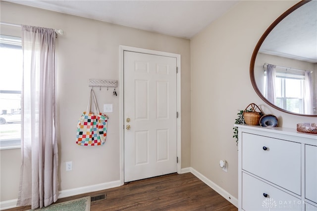 1139 Chalet Dr, New Carlisle, OH 45344 - entryway featuring dark wood-style flooring and baseboards