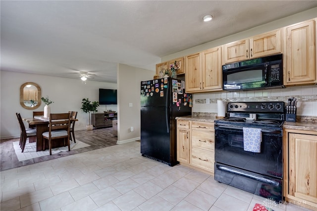 1139 Chalet Dr, New Carlisle, OH 45344 - kitchen featuring black appliances, light brown cabinets, backsplash, a ceiling fan, and baseboards