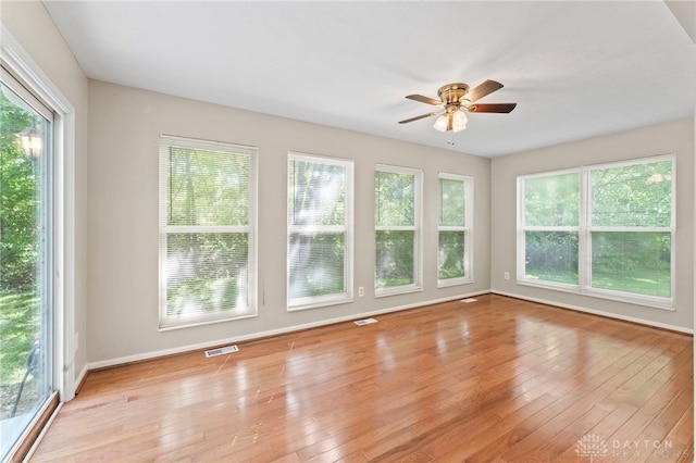 unfurnished sunroom with healthy amount of natural light