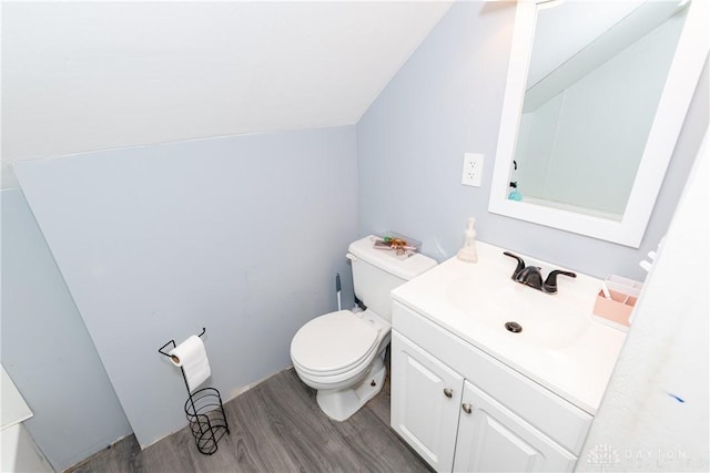 1418 Seminole Dr, Xenia, OH 45385 - half bathroom featuring wood finished floors, toilet, and vanity