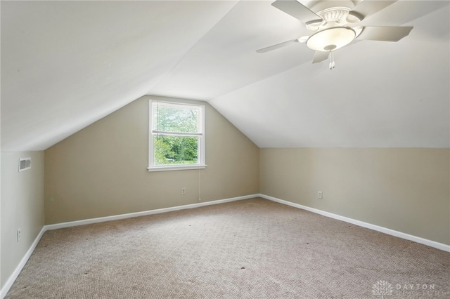 bonus room featuring carpet flooring, baseboards, and vaulted ceiling