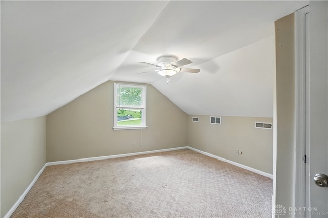 bonus room with carpet, baseboards, ceiling fan, and vaulted ceiling