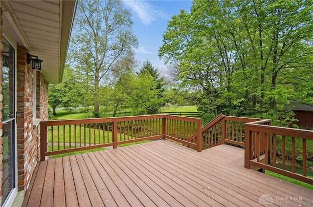 wooden terrace with view of scattered trees