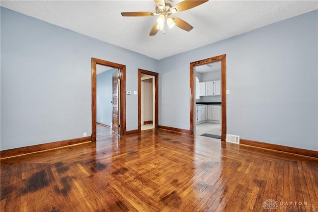 4119 Pleasant View Ave, Dayton, OH 45420 - empty room featuring baseboards, a ceiling fan, and wood finished floors