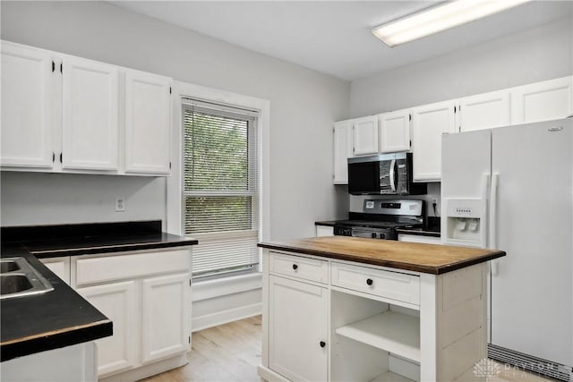 4119 Pleasant View Ave, Dayton, OH 45420 - kitchen featuring stainless steel appliances, white cabinets, wooden counters, light wood-style floors, and open shelves