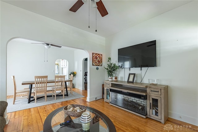 2526 Saint Charles Ave, Dayton, OH 45410 - living area with ceiling fan, arched walkways, and light wood-style flooring