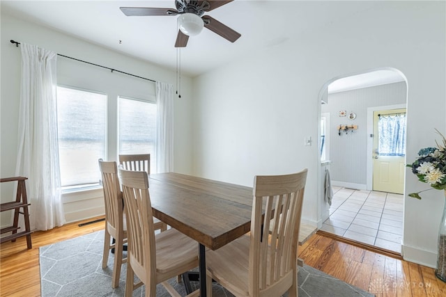 2526 Saint Charles Ave, Dayton, OH 45410 - dining area with arched walkways, ceiling fan, light wood-type flooring, and washer / dryer