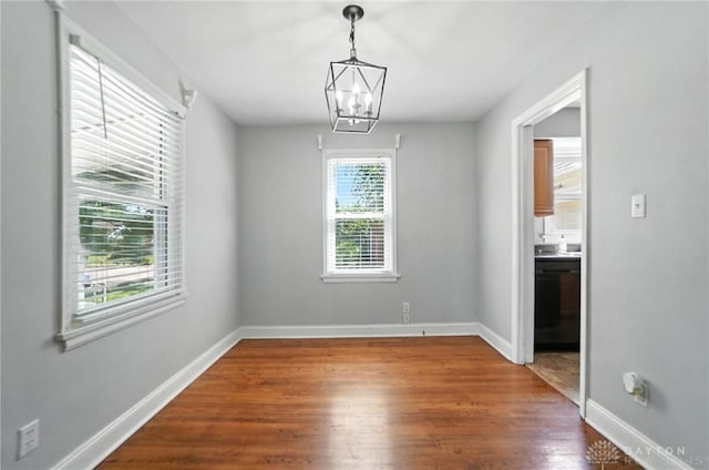 1236 Ridgeview Ave, Kettering, OH 45409 - unfurnished dining area featuring wood finished floors and a chandelier