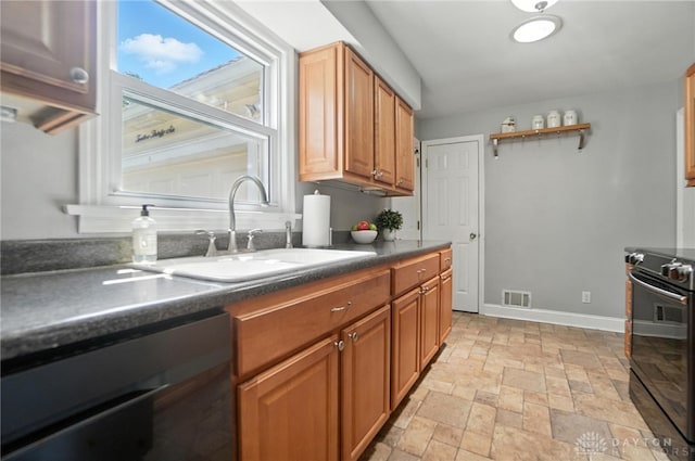 1236 Ridgeview Ave, Kettering, OH 45409 - kitchen featuring black appliances, dark countertops, stone tile floors, open shelves, and brown cabinetry