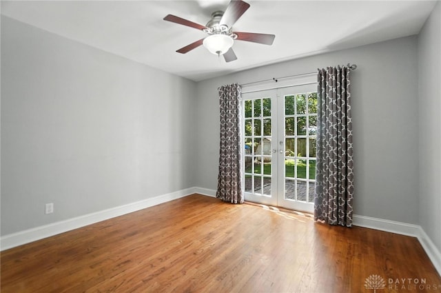 1236 Ridgeview Ave, Kettering, OH 45409 - spare room featuring french doors, wood finished floors, and a ceiling fan
